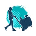 Silhouette of a female worker pushing lori wheels transporting sacks Royalty Free Stock Photo