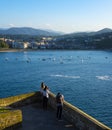 People in active lifestyle, tourists looking at La Concha Bay in the city of San Sebastian, Basque Country. Royalty Free Stock Photo