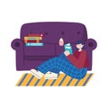 People activities, young woman sitting reading book, sofa with books and cupcake Royalty Free Stock Photo