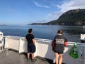 People admiring the beautiful views of the gulf islands on a BC ferries trip through active pass, in the gulf islands, British Col Royalty Free Stock Photo