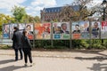 People admiring the elections posters on the voting day