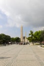 People admiring the Obelisk of Theodosius and Walled obelisk behind it, Istanbul, Turkey Royalty Free Stock Photo