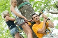 People adventure climbing high tree