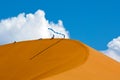 People on orange dunes of Sossusvlei in Namib-Naukluft National Park Namibia Royalty Free Stock Photo