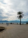 People from afar look at the beautiful view. Observation deck with sea and mountain views