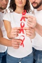 People with aids ribbons in hands