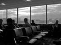 People at airport waiting for fllight, vertical Royalty Free Stock Photo