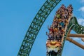 People amazing terrific Cheetah Hunt rollercoaster on lightblue cloudy sky background 72.