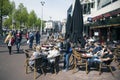 People in amsterdam enjoy sunny day on rembrandtplein Royalty Free Stock Photo