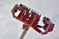 People amuse themselves in a fun fast moving fairground attraction