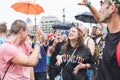 People at the annual Prague Gay Pride parade. Girl dancing in a crowd