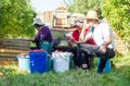 People in apple orchard are sorting apples