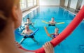 People in aqua fitness class during a physical therapy session Royalty Free Stock Photo