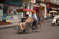 People in the area taking a cyclo ride in Hanoi,Vietnam.