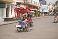 People in the area taking a cyclo ride in Hanoi,Vietnam.