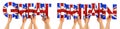 People arms hands holding up wooden letter lettering forming words great britain in union jack uk national flag colors tourism
