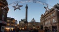 People around Grey`s Monument on Christmas decorated Grey Street