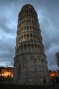 People around the Leaning Tower of Pisa. Marble tower with columns. Night scene. Sundown Royalty Free Stock Photo
