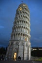 People around the Leaning Tower of Pisa. Marble tower with columns. Night scene. Sundown Royalty Free Stock Photo