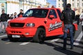 People around the red tech support pickup truck at Palace Square