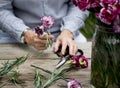 People Arranging Fresh Flowers Vase Concept