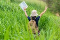 People asia kid holding maps travel backpacks and walking in the jungle forest for education nature