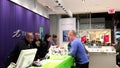 People asking telus sales clerk about cellphone plan