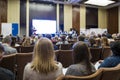 People Attending Business Conference Sitting in Front of the Host Royalty Free Stock Photo