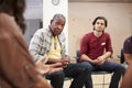 People Attending Self Help Therapy Group Meeting In Community Center Royalty Free Stock Photo