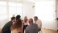 People Attending Support Group Meeting For Mental Health Or Dependency Issues In Community Space Royalty Free Stock Photo