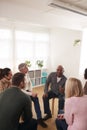 People Attending Support Group Meeting For Mental Health Or Dependency Issues In Community Space Royalty Free Stock Photo
