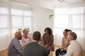 People Attending Support Group Meeting For Mental Health Or Dependency Issues In Community Space Royalty Free Stock Photo