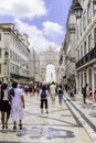 View of People on Augusta street with the Triumphal Arch, the famous tourist attraction in Lisbon