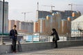 People on background of houses under construction in Moscow