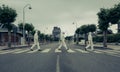 People with bacteriological protection suits in a crosswalk