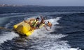 PEOPLE ON A BANANA BOAT
