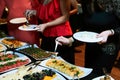 People at a banquet taking different food. Colleagues Buffet Party Brunch Dining Concept