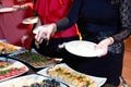 People at a banquet taking different food. Colleagues Buffet Party Brunch Dining Concept