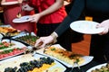 People at a banquet taking different food. Colleagues Buffet Party Brunch Dining Concept