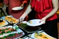 People at a banquet taking different food. Colleagues Buffet Party Brunch Dining Concept