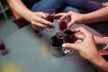 people at the bar try tinctures, red tinctures in glasses, alcoholic shots. Royalty Free Stock Photo