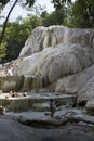 People bathing in Bagni San Filippo