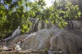 People bathing in Bagni San Filippo natural thermal