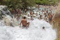 People bathing in natural spa of the hot Mill waterfalls of cascate dele Mulino. Grosseto, Tuscany, Royalty Free Stock Photo