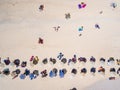 People bathing in the sun on the beach. Tourists on a sand beach