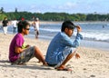 PEOPLE ON THE BEACH IN BALI Royalty Free Stock Photo