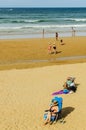 People on the beach in Gijon Spain