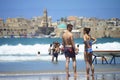 People in the beach of old city Acre, Israel.