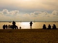 People on the beach at sunset Royalty Free Stock Photo