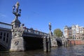 People on beautiful The Blue Bridge (Blauwbrug) , Amsterdam Royalty Free Stock Photo